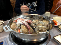 Fresh seafood soup in a small neighborhood restaurant in Jeju